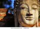 face-of-buddha-ruins-of-ancient-temple-ayutthaya-22063324-thumbnail