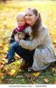 young-mother-and-her-little-daughter-outdoors-on-sunny-autumn-day-thumbnail