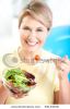 mature-smiling-woman-with-fruits-and-vegetables-thumbnail