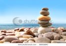 stack-of-pebble-stones-on-white-background-56662840-thumbnail