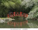 red-bridge-over-water-in-a-japanese-garden-11148442-thumbnail