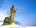 walking-buddha-image-in-vitarka-mudra-posture-illuminate-with-spotlight-at-twilight-time-64275376-thumbnail