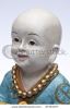 child-monk-statue-shot-as-a-portrait-thumbnail
