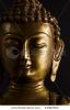 portrait-of-a-buddha-statue-with-black-background-44082502-thumbnail
