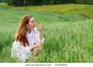 young-woman-and-wild-flowers-55368202-thumbnail