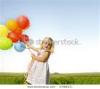 adorable-young-girl-holds-tightly-to-a-large-bunch-of-helium-filled-balloons-57684271-thumbnail