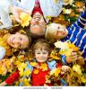 cute-family-in-a-park-on-an-autumn-day-19218325-thumbnail
