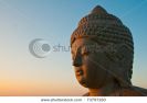 head-of-buddha-statue-isolated-against-dawn-or-dusk-sky-73797160-thumbnail