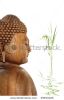 buddha-with-eyes-closed-in-prayer-and-bamboo-leaf-grass-with-reflection-in-rippled-water-over-39943126-thumbnail