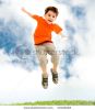 young-boy-jumping-and-raising-hands-in-outside-thumbnail